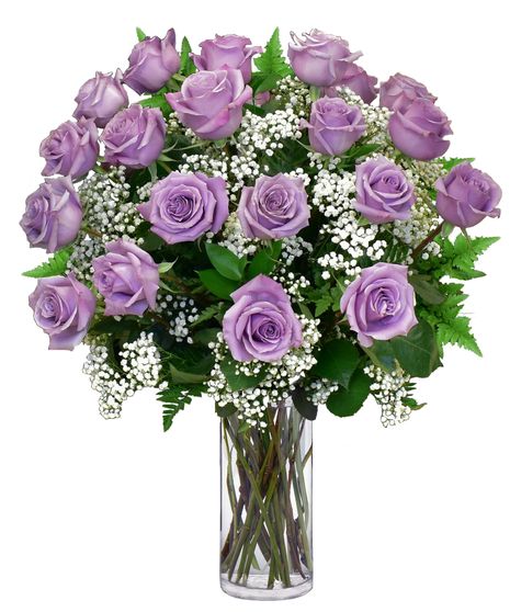 purple roses and babys breath in a clear glass vase