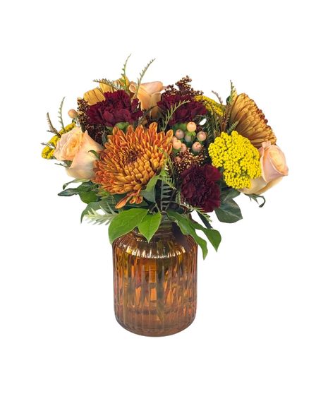 Bronze Mums, peach roses, peach berries, yarrow and burgundy carnations