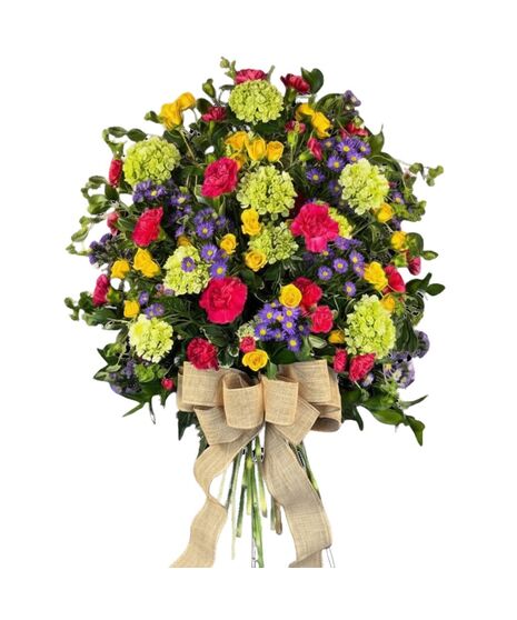 Gorgeous calla lilies and roses in a stylized standing spray