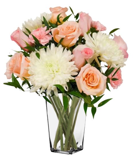 soft peach roses, pink carnations, and white mums in a clear glass vase